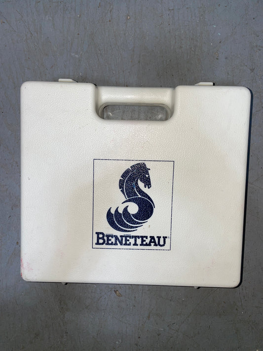 White box with Beneteau logo on a gray surface