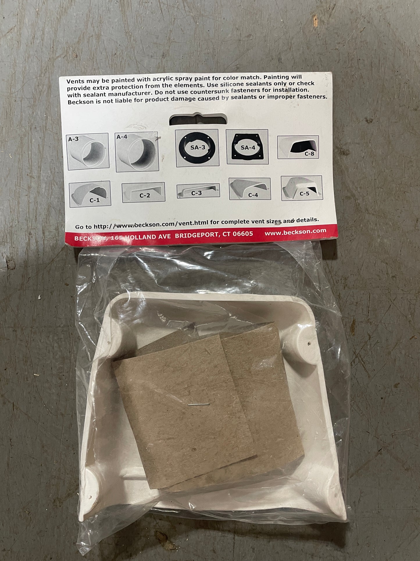 Packaged product with a leaflet on a concrete surface