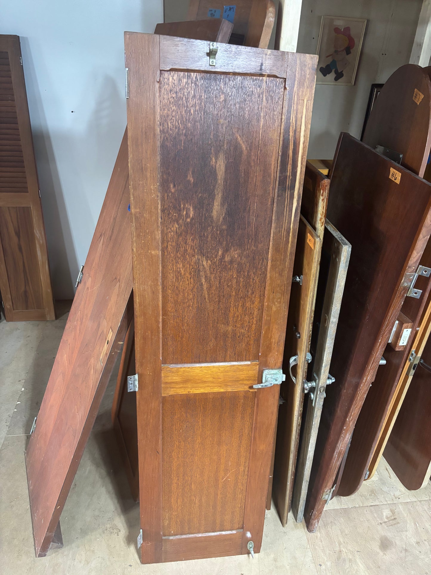 Stack of wooden shutters in a storage room