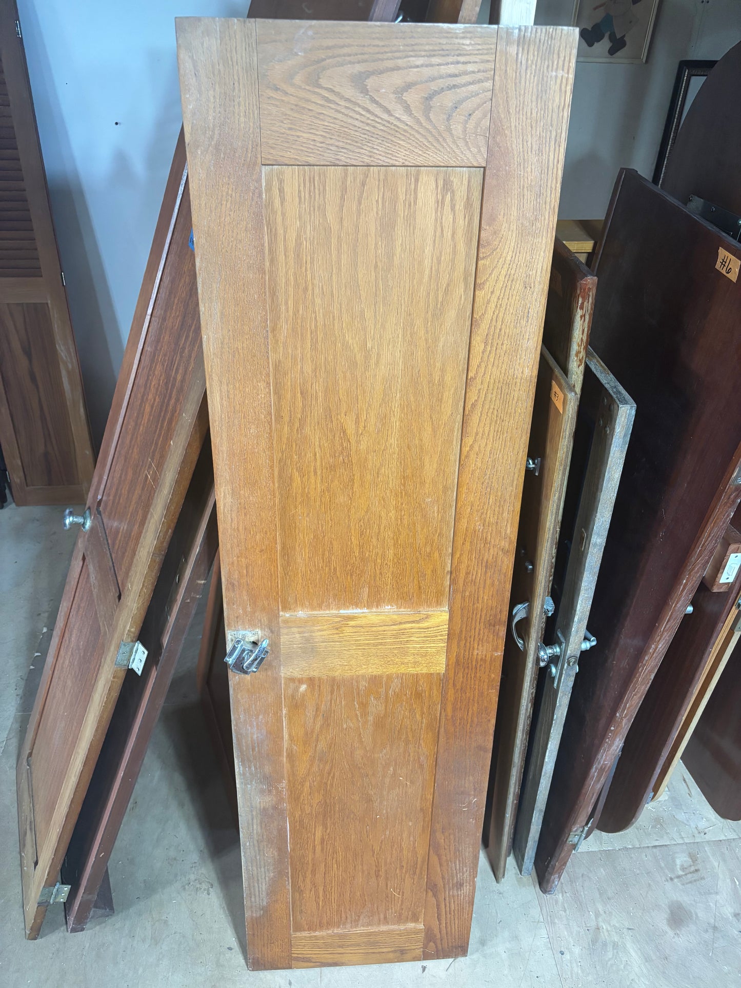 Stack of wooden doors in a storage or warehouse setting