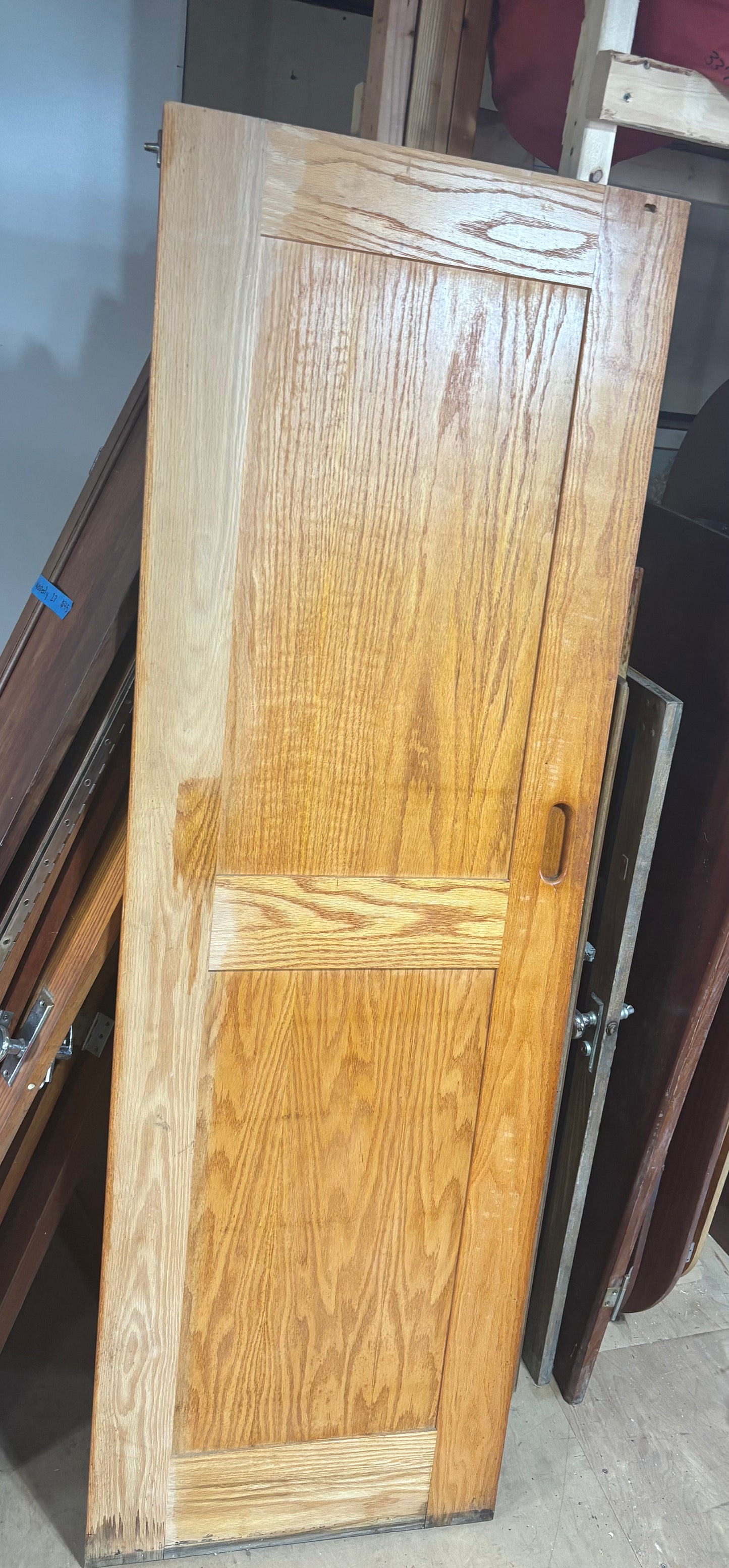 Wooden door with a visible grain pattern on a blurred background