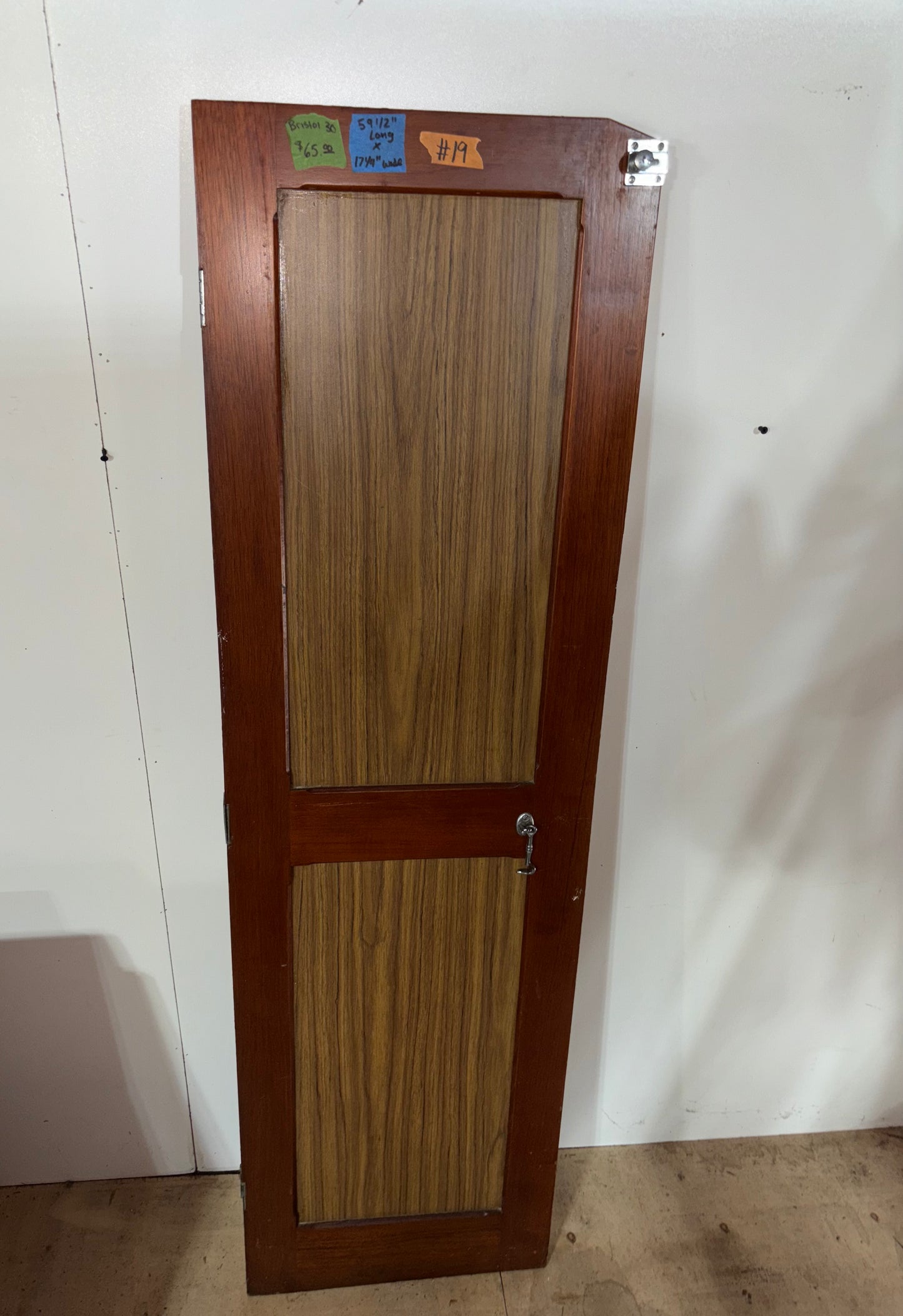 Wooden door with a glass panel on a white background