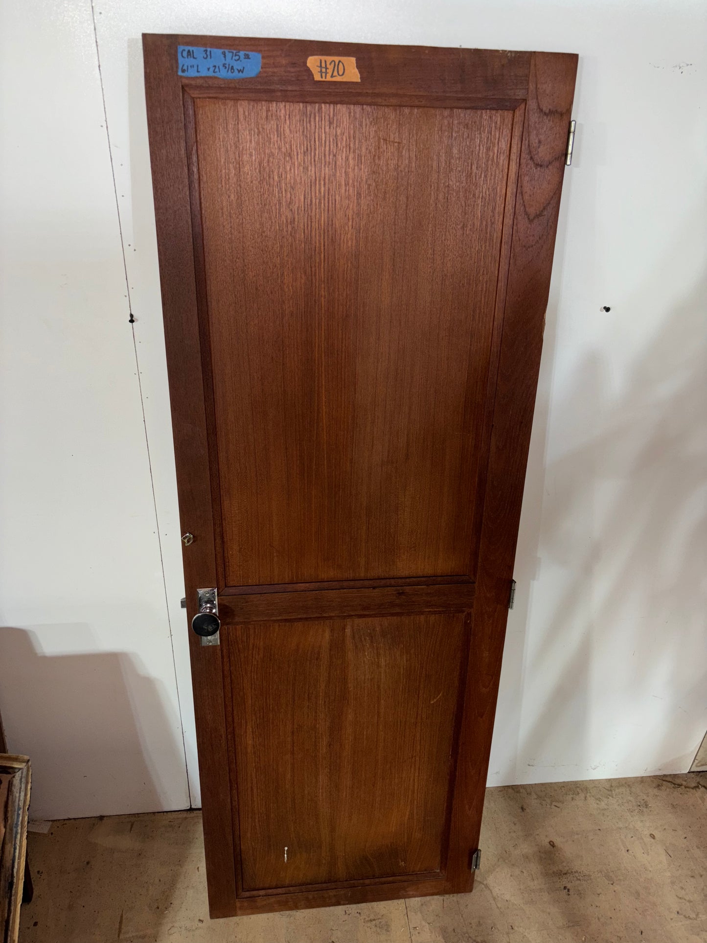 Wooden door with a lock on a white background