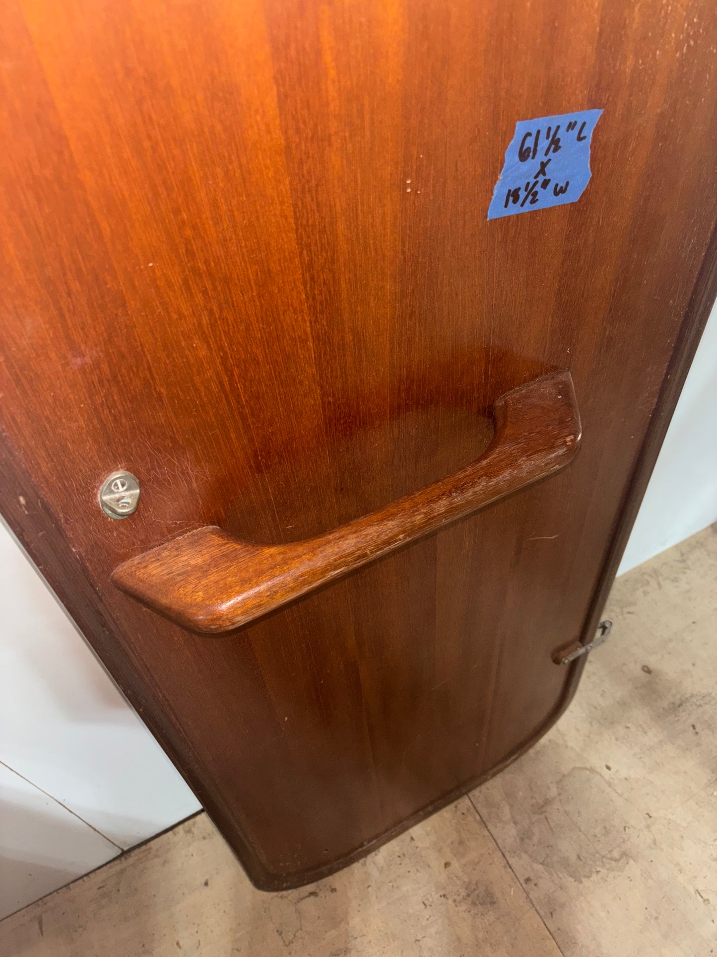 Wooden door with a handle and measurement label on a white background