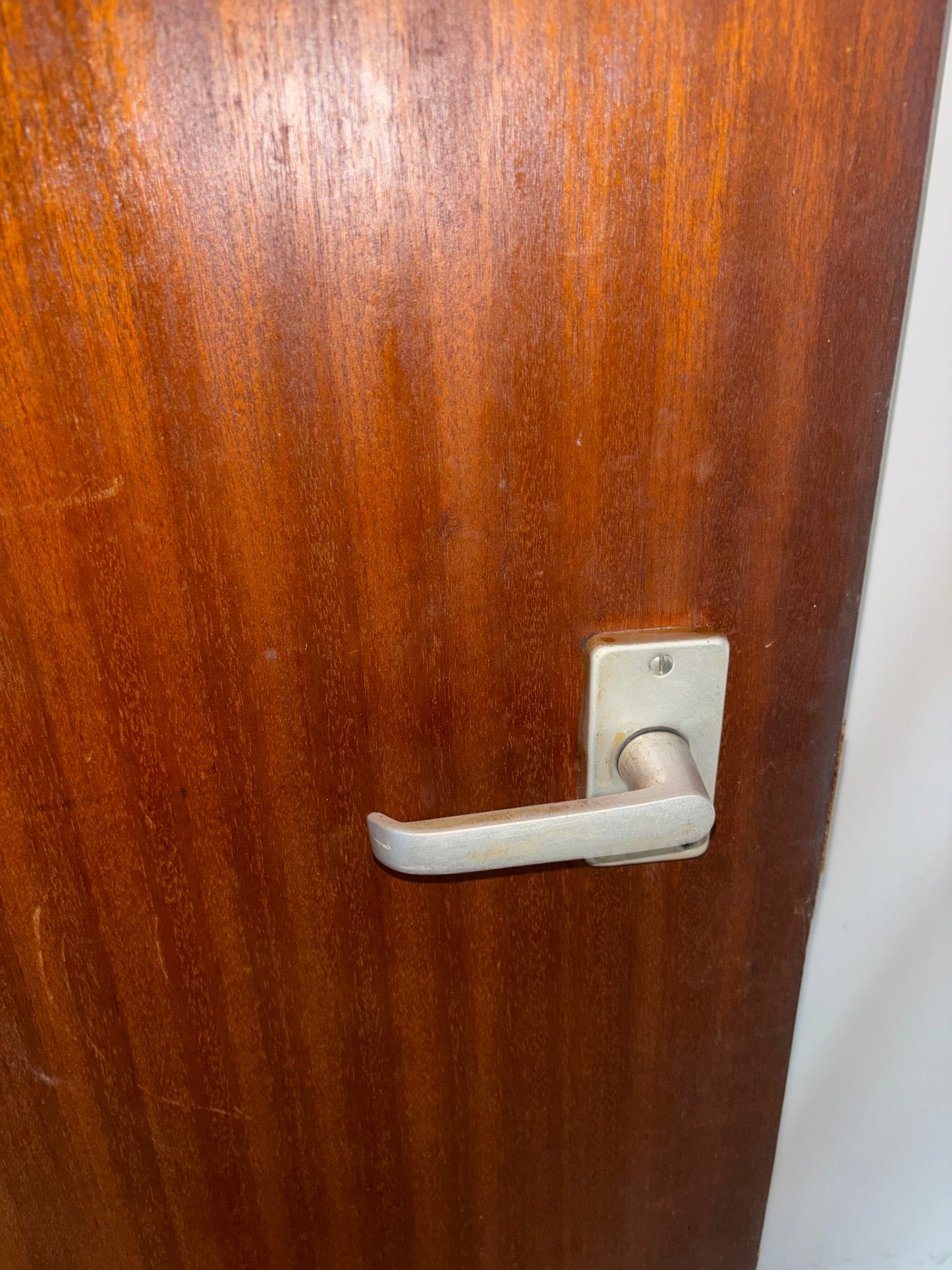 Wooden door with a metal handle