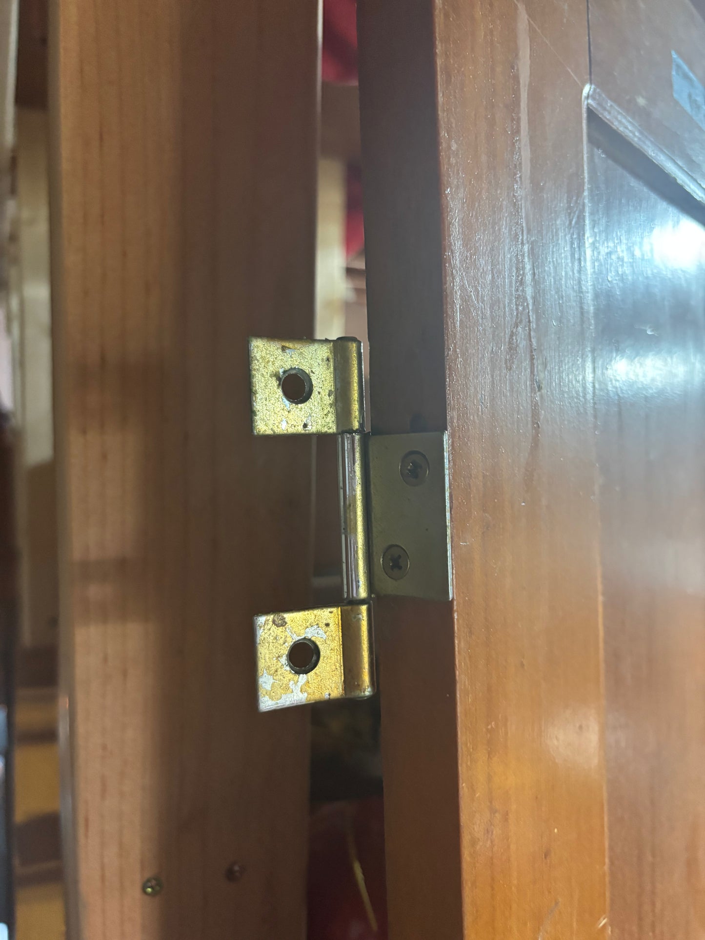 Wooden door with a metal hinge