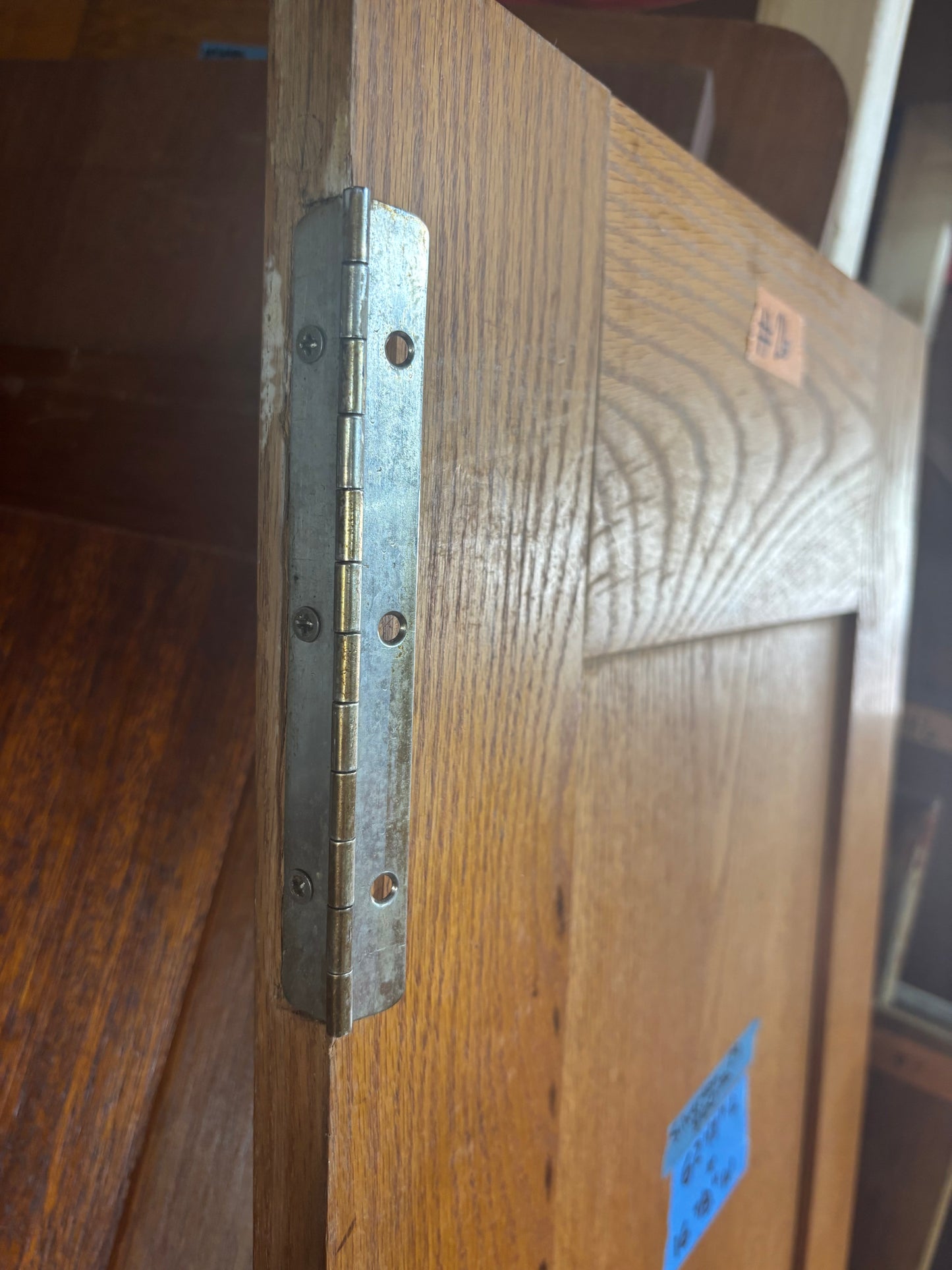 Wooden door with a metal hinge
