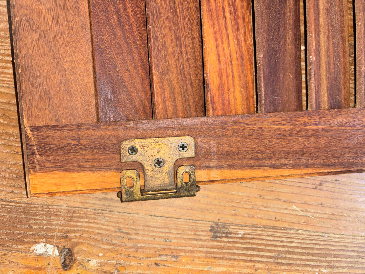 Wooden door with a metal hinge