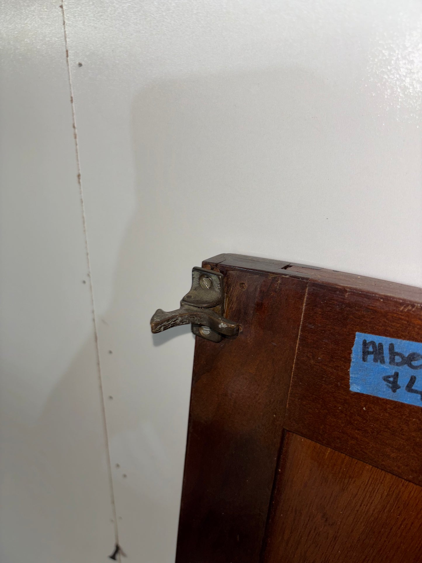 Wooden box with a metal latch on a white background