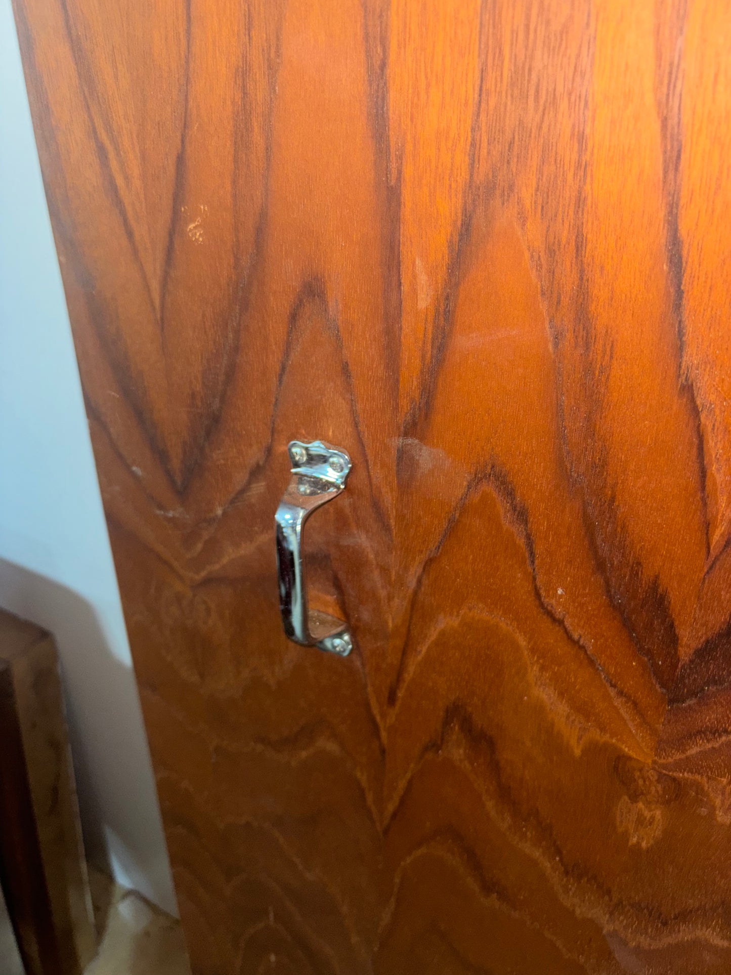 Wooden door with a silver handle