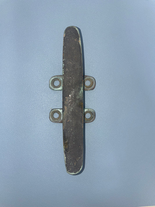 Metal cleat on a light blue background