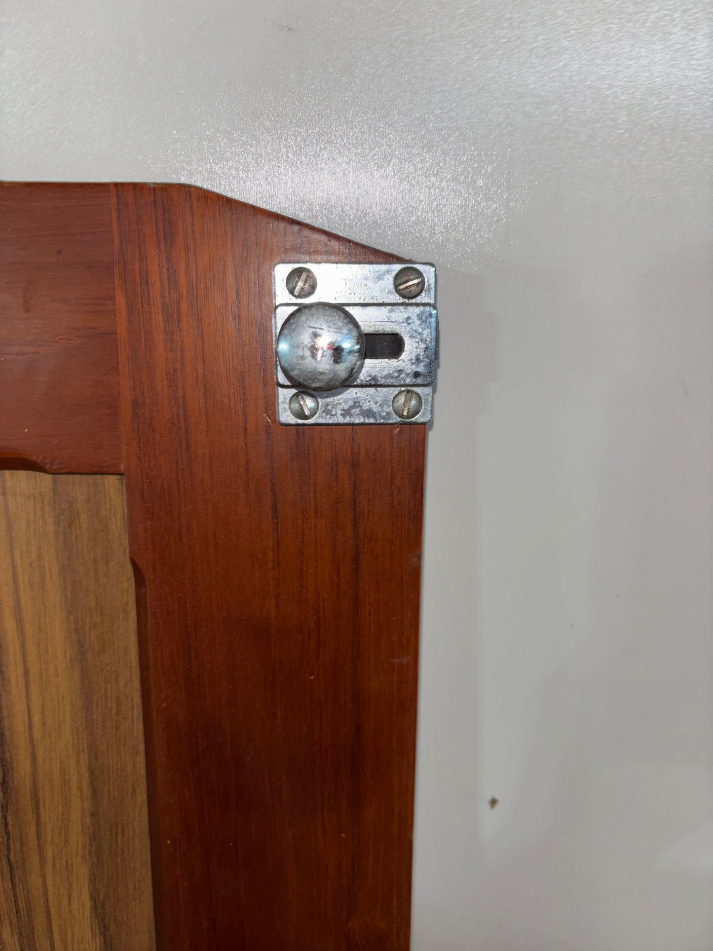 Wooden surface with a metal bracket attached