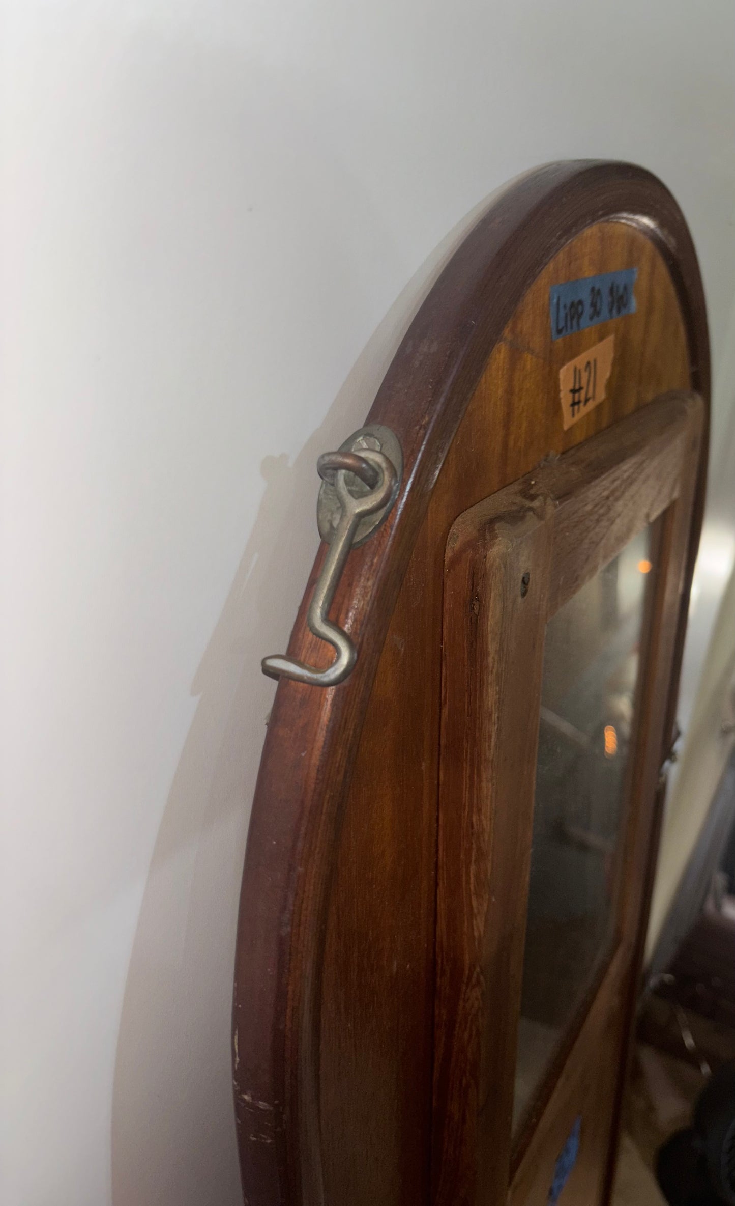 Wooden door with a glass panel on a beige background